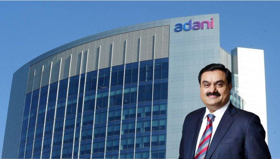 Adani Group headquarters with Gautam Adani featured in the Adani vs Reliance business comparison.